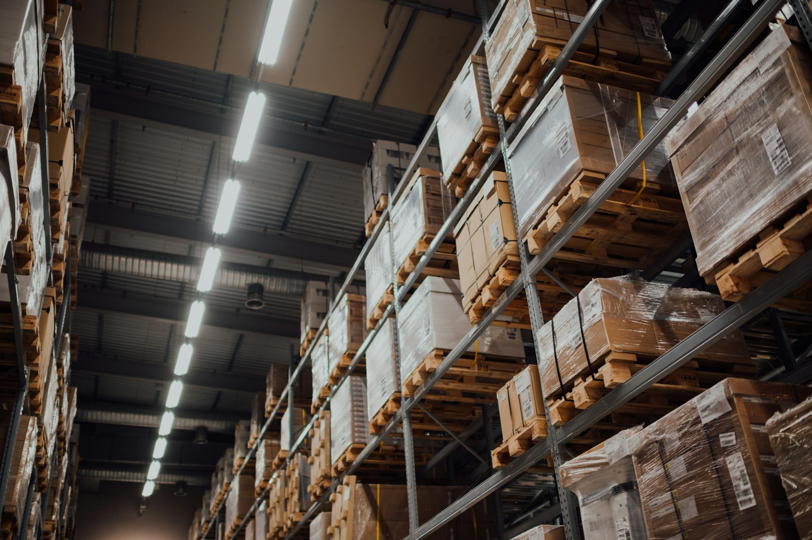 Warehouse racking lit by LED linear fixtures
